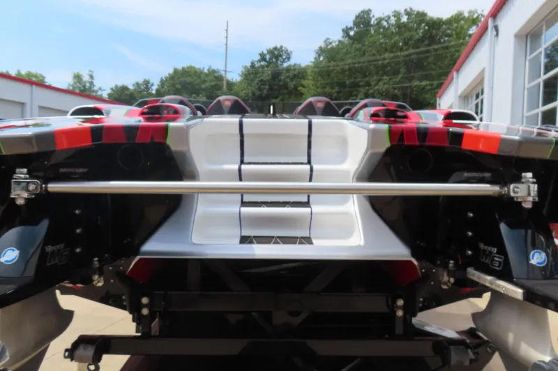 Slide: The Image of 2025 Skater 388 boat rear view with vibrant design and powerful Mercury engines. - 13