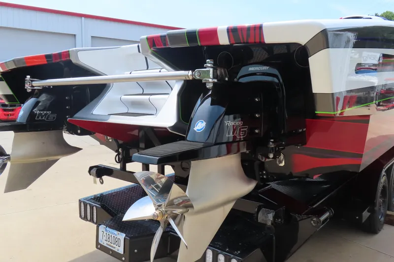 Slide: The Image of 2025 Skater 388 boat with dual Mercury Racing M6 engines and sleek design. - 14