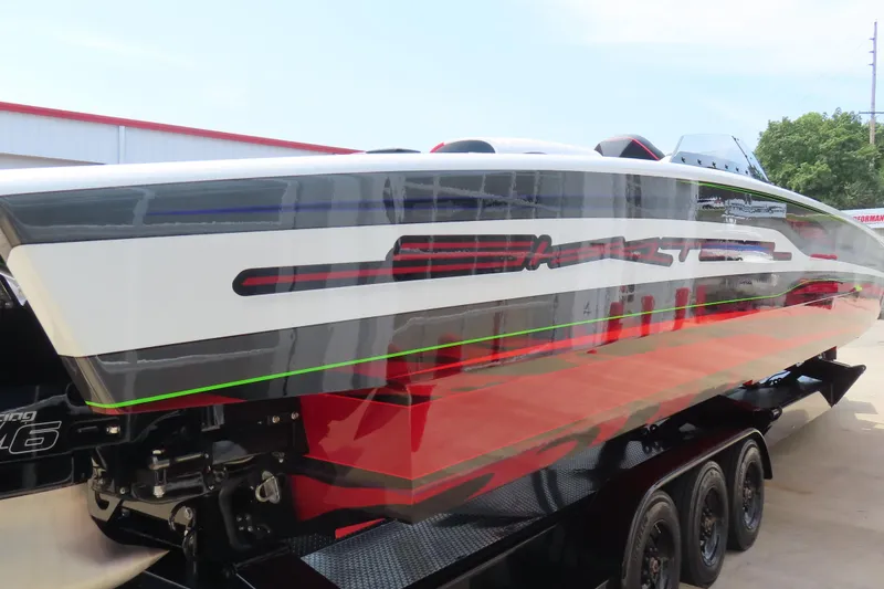Slide: The Image of 2025 Skater 388 powerboat with sleek design and vibrant graphics on a trailer. - 15
