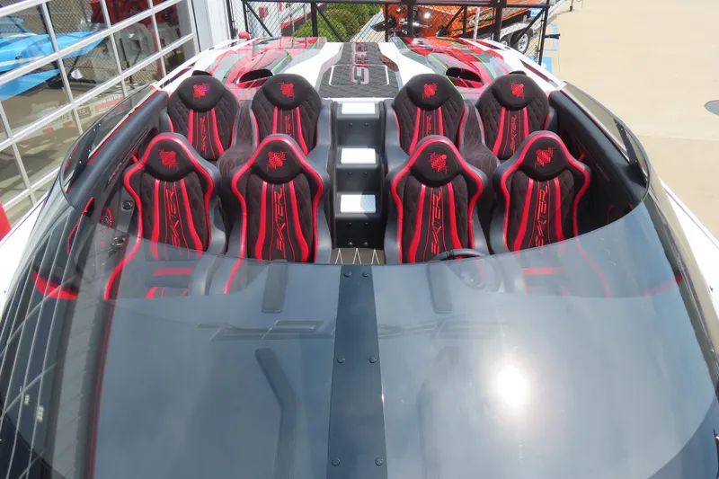 Slide: The Image of 2025 Skater 388 boat interior with red and black racing seats, showcasing luxury design. - 18