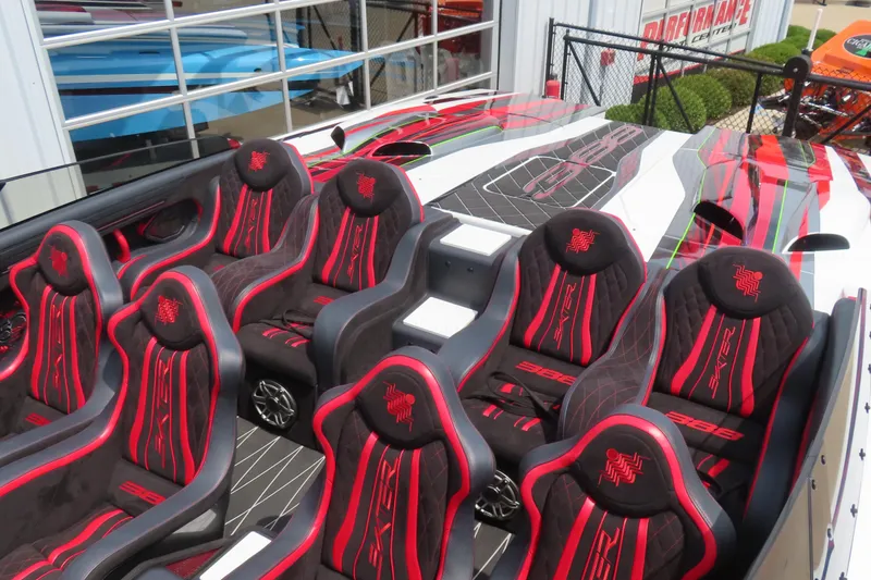 Slide: The Image of Luxury Skater 388 boat interior with red and black seats, 2025 model. - 19
