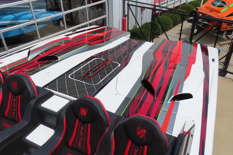 Slide: The Image of 2025 Skater 388 boat with vibrant red and black design, featuring sleek seating. - 20