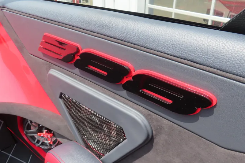 Slide: The Image of Interior detail of 2025 Skater 388, featuring bold red and black design elements. - 33