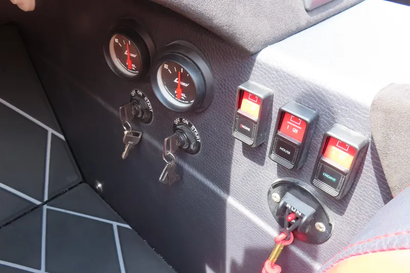 Slide: The Image of Control panel of 2025 Skater 388 with switches, gauges, and ignition keys. - 5