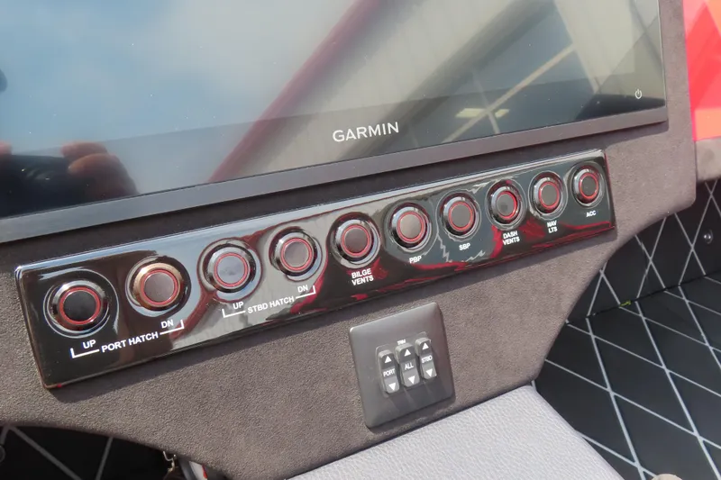 Slide: The Image of Control panel of Skater 388 boat, featuring Garmin display and various function buttons. - 7