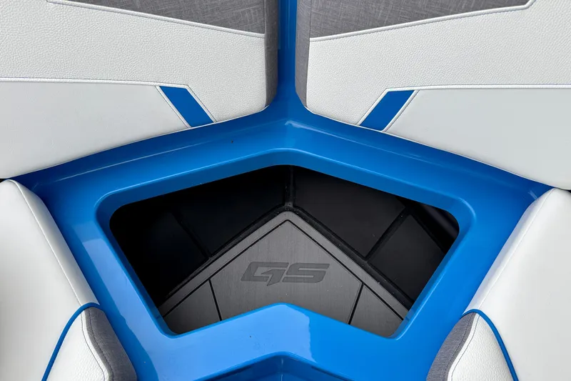 Slide: The Image of 2025 Nautique Super Air Nautique GS24 interior detail with blue and white seating. - 18