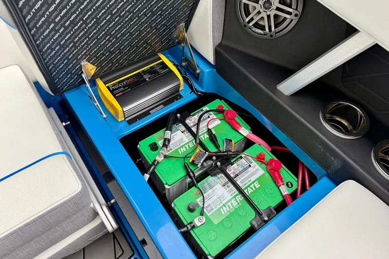 Slide: The Image of 2025 Nautique Super Air Nautique GS24 battery compartment with ProSport HD12 charger. - 22