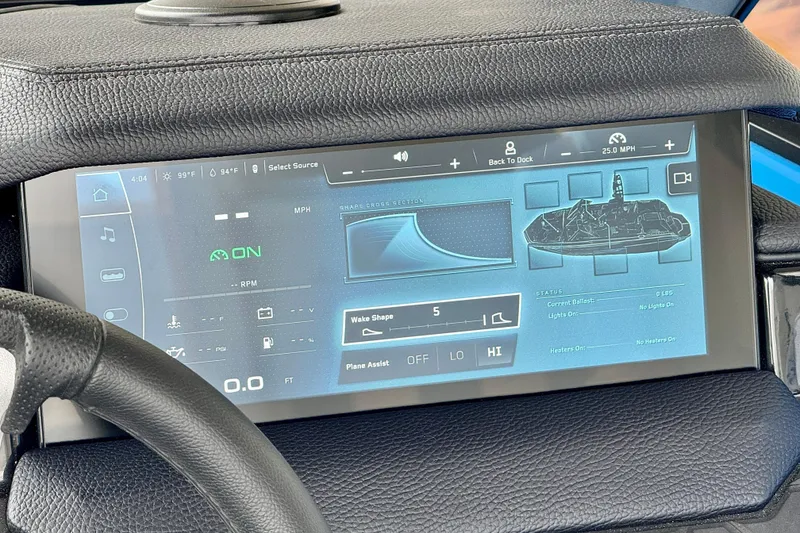 Slide: The Image of 2025 Nautique Super Air Nautique GS24 dashboard display with digital controls and navigation. - 35