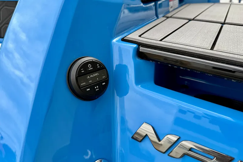 Slide: The Image of 2025 Nautique Super Air Nautique GS24, blue exterior, JL Audio control panel. - 43