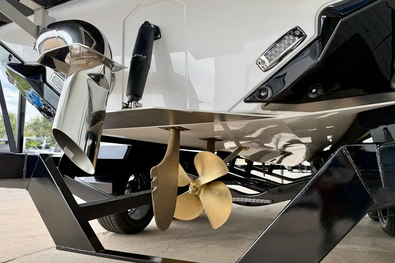 Slide: The Image of 2025 Nautique Super Air Nautique GS24 boat propeller and exhaust detail. - 6