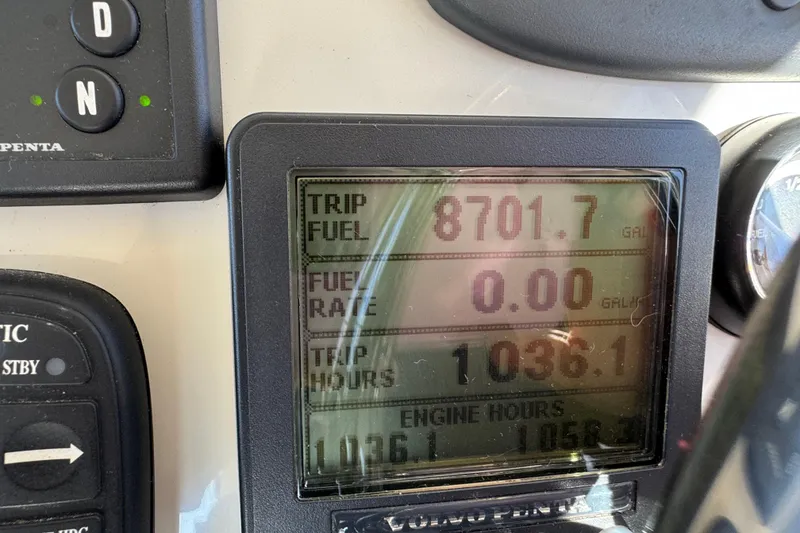 Slide: The Image of Close-up of Ocean Sport Roamer 30 dashboard display showing trip fuel and engine hours. - 25