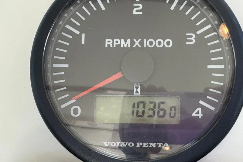 Slide: The Image of Volvo Penta RPM gauge displaying 1036 hours on Ocean Sport Roamer 30, 2005 model. - 27