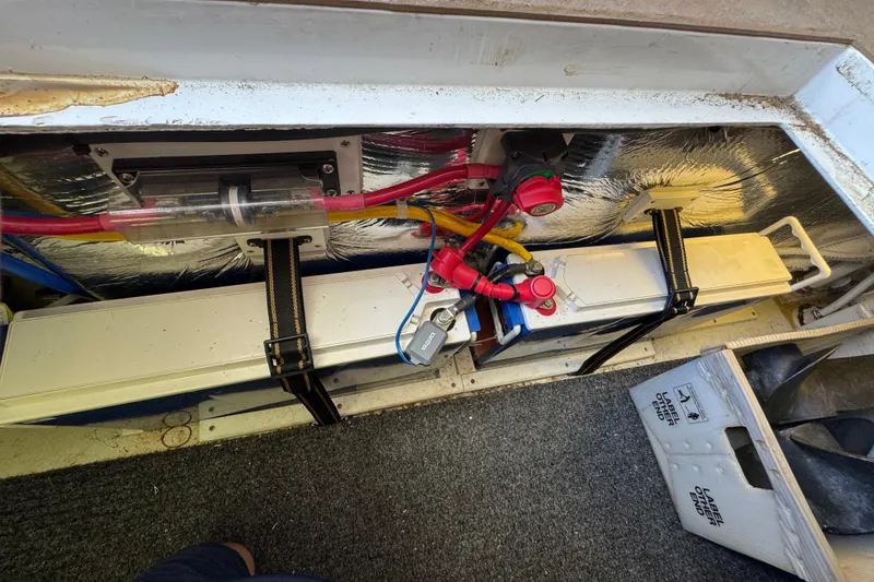 Slide: The Image of Electrical compartment of a 2005 Ocean Sport Roamer 30 boat, featuring wiring and components. - 41