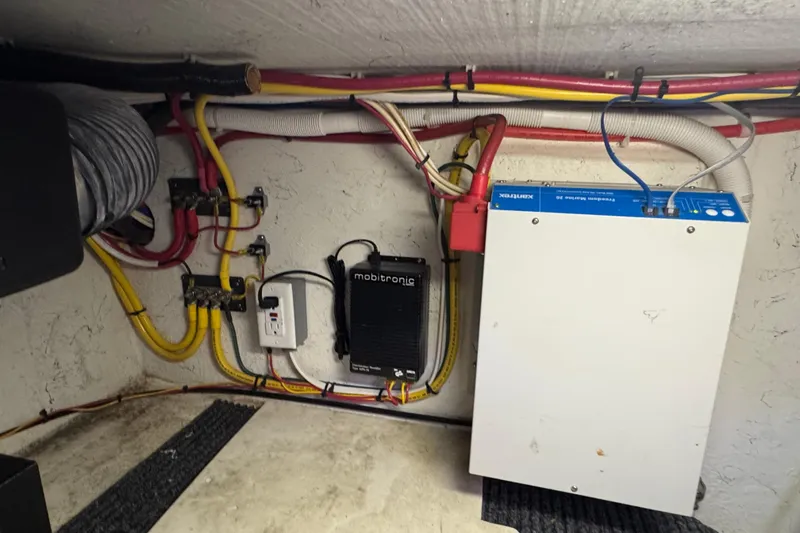 Slide: The Image of Electrical wiring and components inside a 2005 Ocean Sport Roamer 30 boat. - 43