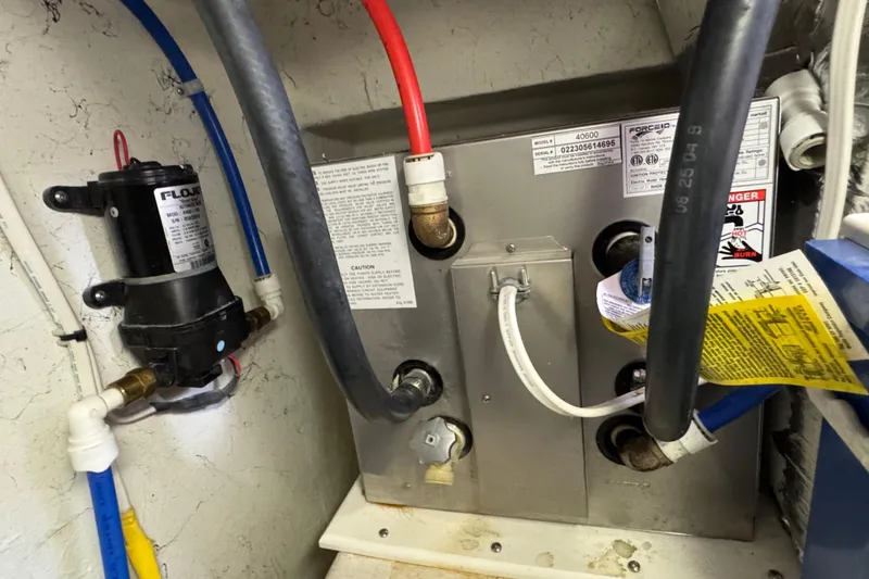 Slide: The Image of Boat engine compartment with plumbing and electrical components, Ocean Sport Roamer 30, 2005 model. - 44