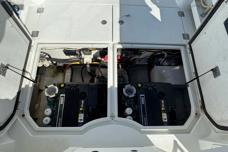 Slide: The Image of Engine compartment of 2005 Ocean Sport Roamer 30, showcasing dual Volvo Penta engines. - 49