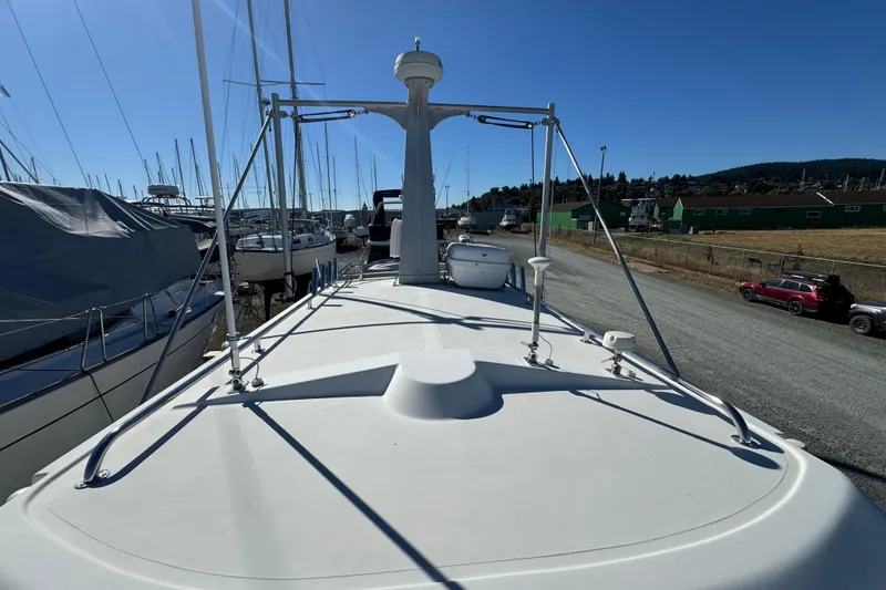 Slide: The Image of 2005 Ocean Sport Roamer 30 boat on dry dock under clear blue sky. - 5