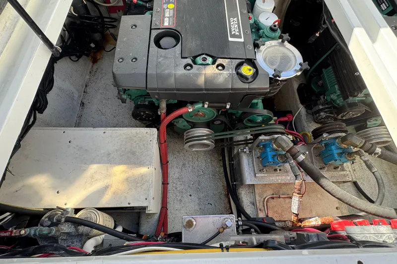 Slide: The Image of Engine compartment of a 2005 Ocean Sport Roamer 30 boat, featuring Volvo Penta components. - 50