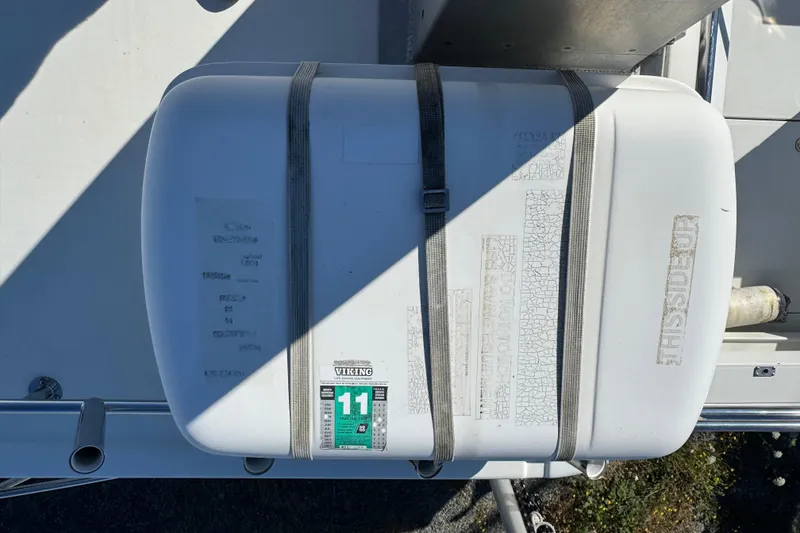 Slide: The Image of Life raft on 2005 Ocean Sport Roamer 30 boat deck, secured with straps. - 9