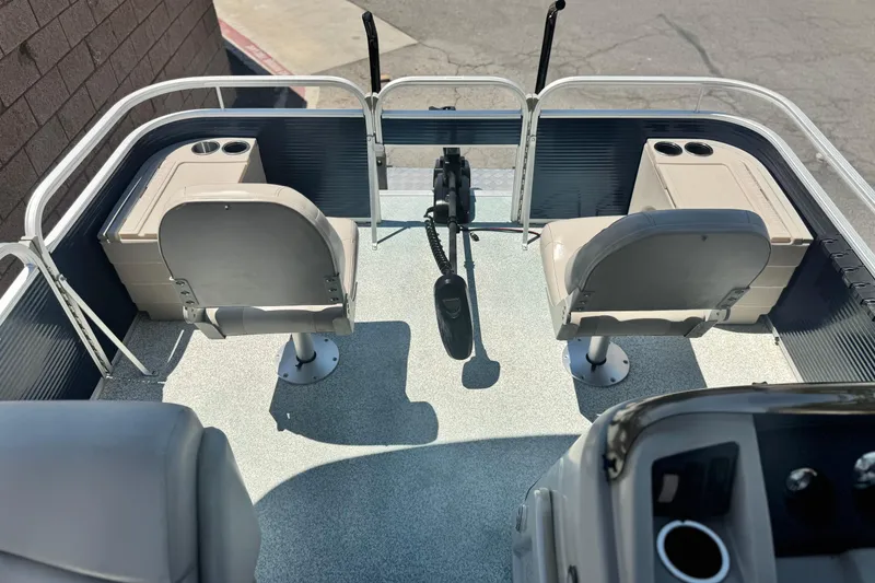 Slide: The Image of 2019 Bennington 188 SV boat interior with dual seats and cup holders. - 10