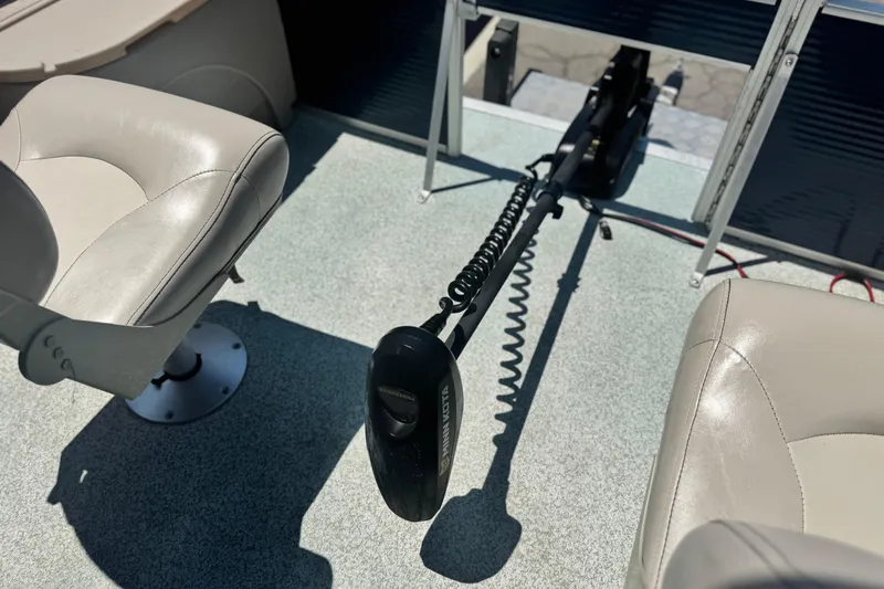 Slide: The Image of Interior of a 2019 Bennington 188 SV boat with seating and trolling motor. - 11