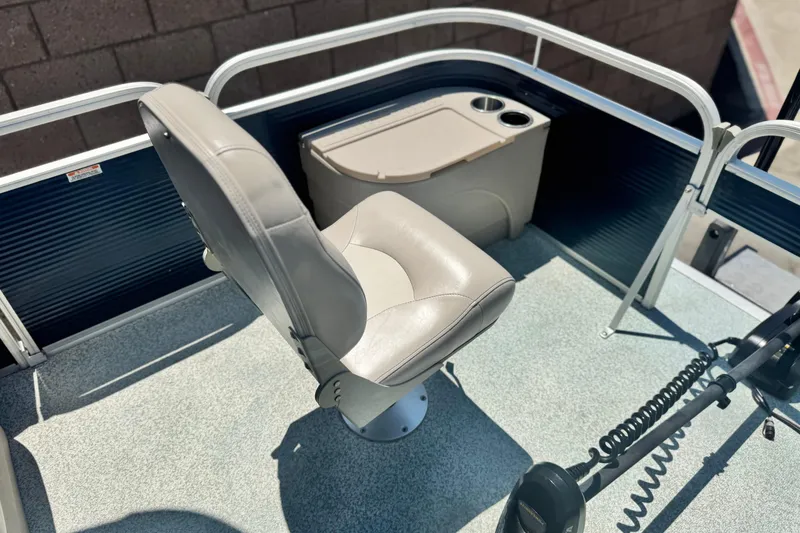 Slide: The Image of 2019 Bennington 188 SV boat interior with captain's chair and control panel. - 12