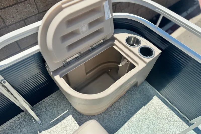 Slide: The Image of Open storage compartment with cup holders on a 2019 Bennington 188 SV boat. - 14