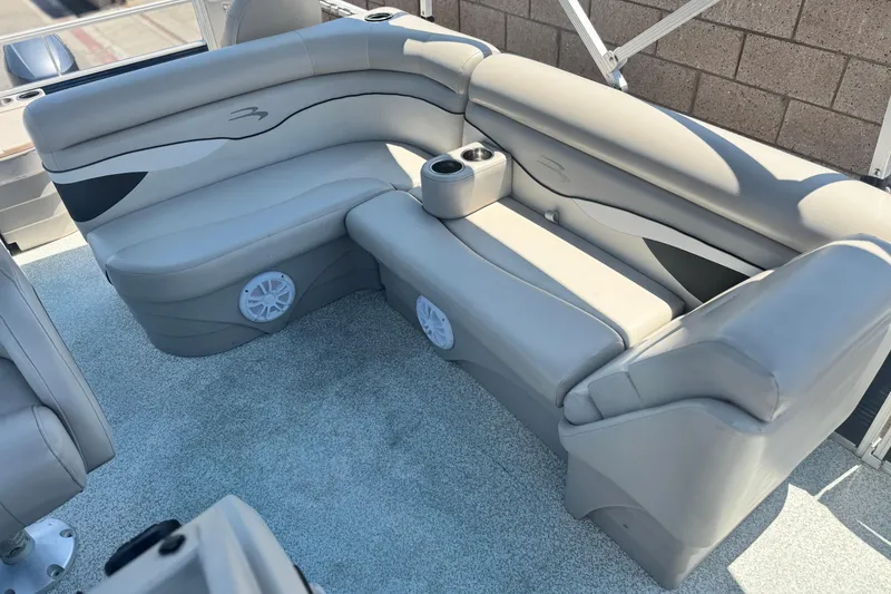 Slide: The Image of 2019 Bennington 188 SV boat interior with gray seating and cup holders. - 16