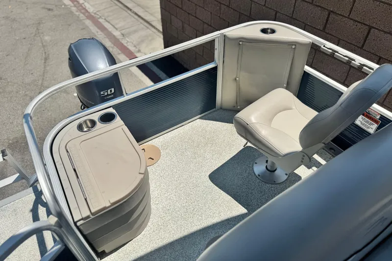 Slide: The Image of 2019 Bennington 188 SV pontoon boat interior with seating and Yamaha 50 engine. - 17