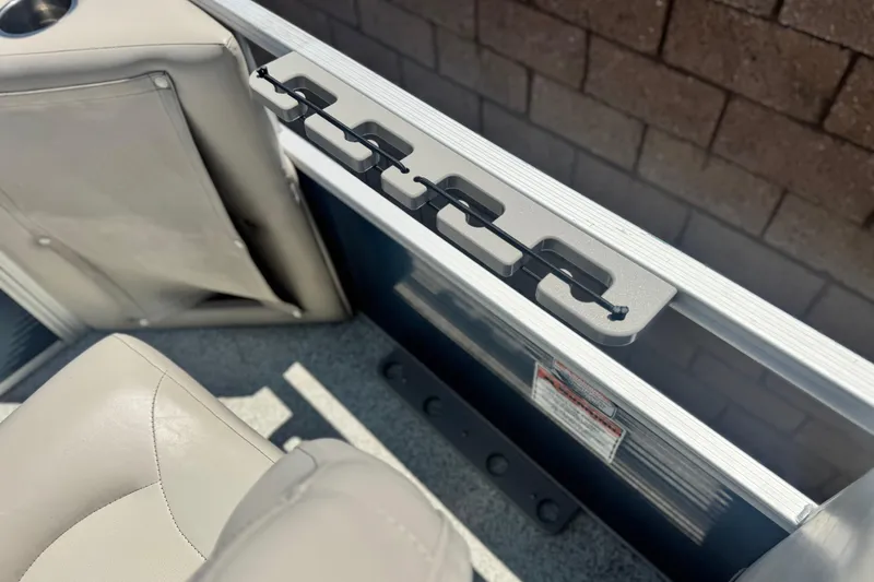 Slide: The Image of 2019 Bennington 188 SV boat interior with beige seating and rod holder. - 21