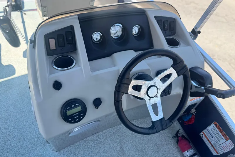 Slide: The Image of 2019 Bennington 188 SV boat dashboard with steering wheel and control panel. - 24