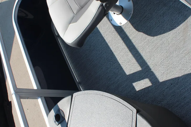 Slide: The Image of 2026 Sun Tracker Bass Buggy 18 DLX interior with seat and flooring detail. - 13