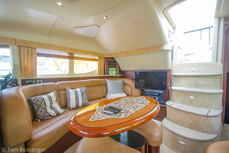 Slide: The Image of Luxurious interior of 2005 Sea Ray 390 Motor Yacht with plush seating and elegant decor. - 12