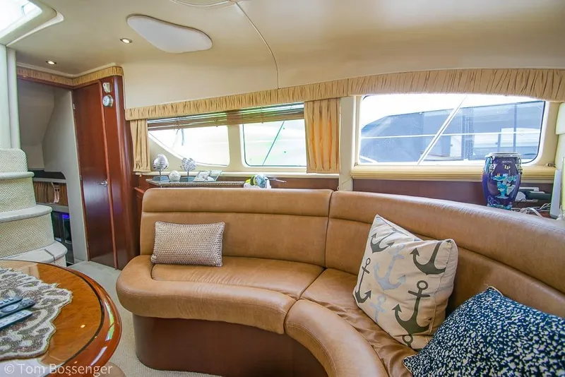 Slide: The Image of Luxurious interior of 2005 Sea Ray 390 Motor Yacht with plush seating and nautical decor. - 13