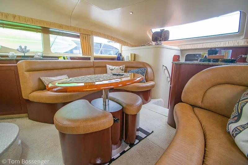 Slide: The Image of Luxurious interior of 2005 Sea Ray 390 Motor Yacht with plush seating and elegant decor. - 14