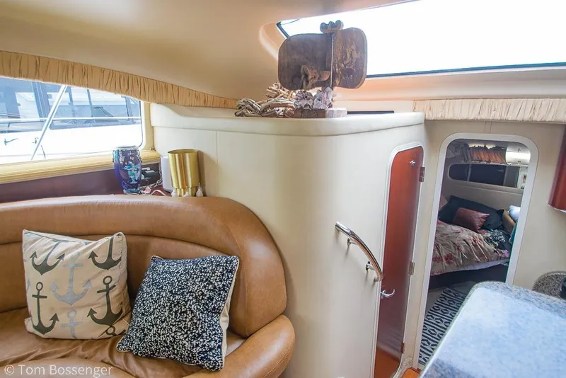 Slide: The Image of Luxurious interior of 2005 Sea Ray 390 Motor Yacht with cozy seating and elegant decor. - 17