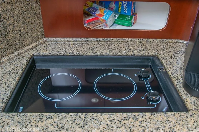 Slide: The Image of Granite countertop with electric stove in 2005 Sea Ray 390 Motor Yacht kitchen. - 21