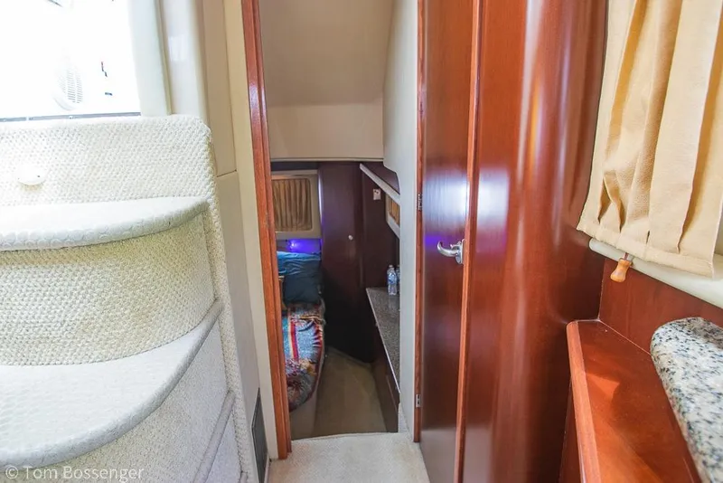 Slide: The Image of Interior of 2005 Sea Ray 390 Motor Yacht with cozy cabin and wooden finishes. - 23