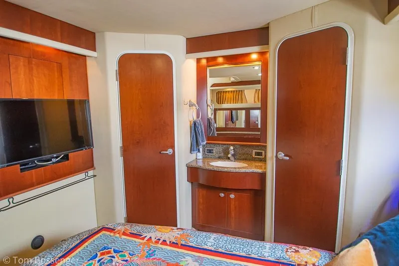 Slide: The Image of Interior of 2005 Sea Ray 390 Motor Yacht with wood cabinetry and vanity. - 27