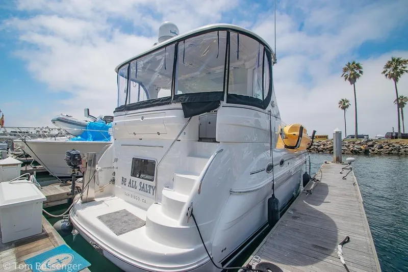 Slide: The Image of 2005 Sea Ray 390 Motor Yacht docked in sunny marina setting. - 3