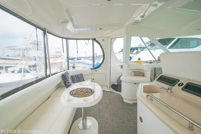 Slide: The Image of Interior of 2005 Sea Ray 390 Motor Yacht with elegant seating and kitchenette. - 43