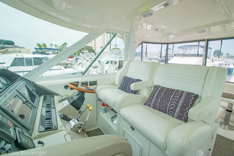Slide: The Image of Interior of 2005 Sea Ray 390 Motor Yacht with plush seating and modern controls. - 51