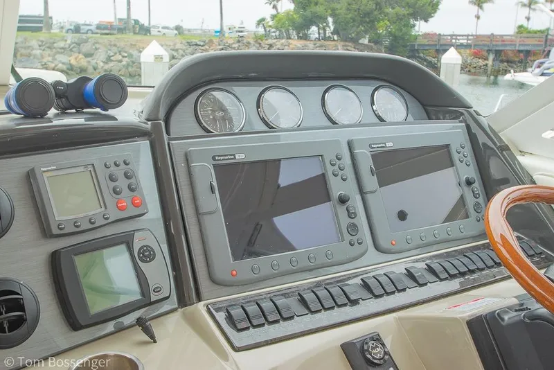 Slide: The Image of 2005 Sea Ray 390 Motor Yacht dashboard with navigation equipment and controls. - 53