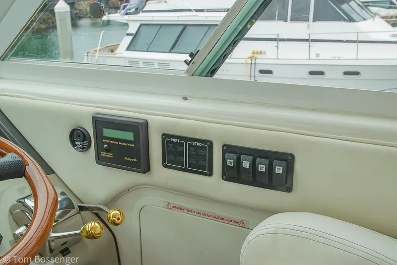 Slide: The Image of 2005 Sea Ray 390 Motor Yacht helm with control panel and systems monitor. - 54