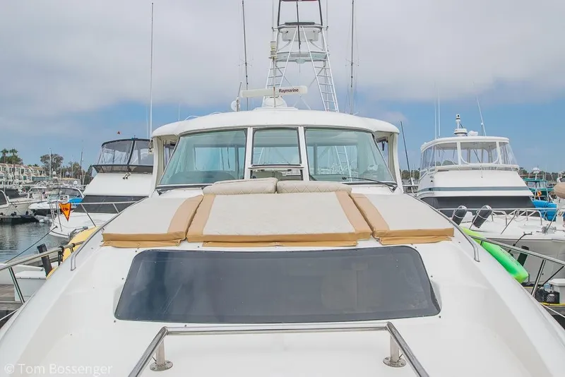 Slide: The Image of 2005 Sea Ray 390 Motor Yacht docked in marina, front view. - 58
