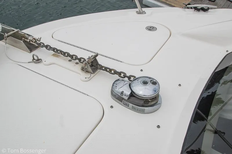 Slide: The Image of 2005 Sea Ray 390 Motor Yacht anchor chain and windlass on deck. - 60