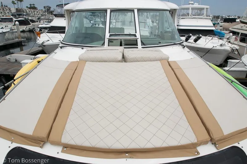 Slide: The Image of 2005 Sea Ray 390 Motor Yacht with spacious sunbathing deck in marina setting. - 64