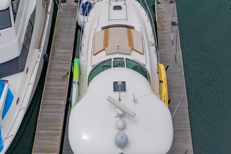 Slide: The Image of Overhead view of a 2005 Sea Ray 390 Motor Yacht docked with kayaks. - 66