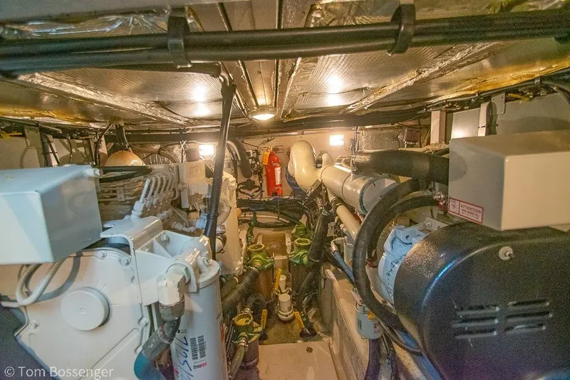 Slide: The Image of Engine room of a 2005 Sea Ray 390 Motor Yacht, showcasing machinery and equipment. - 67