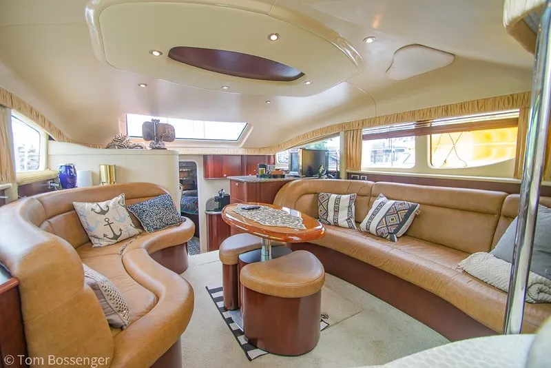 Slide: The Image of Luxurious interior of 2005 Sea Ray 390 Motor Yacht with plush seating and elegant decor. - 9